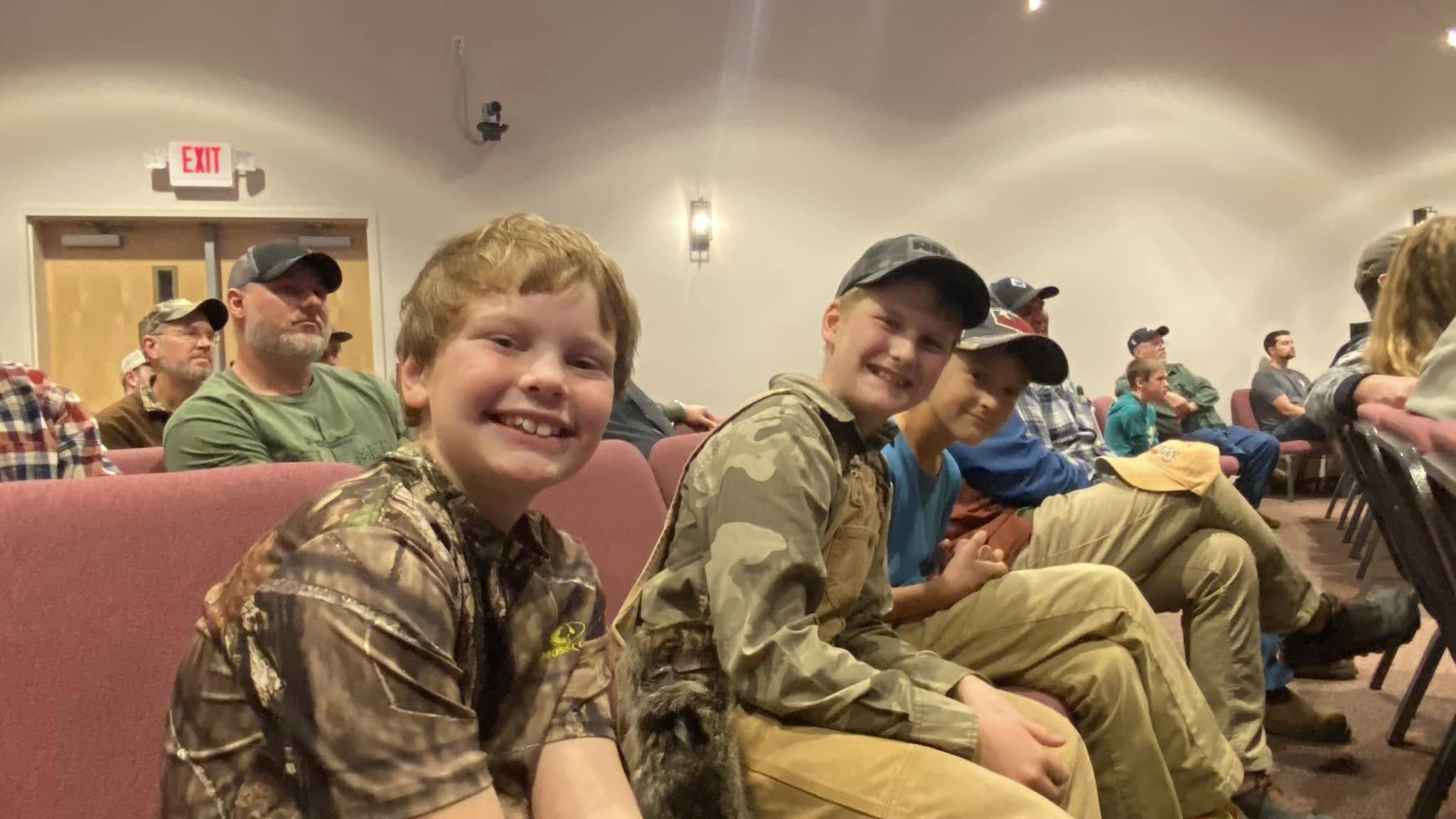 Boys grinning in the back row